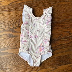 Girls floral ruffle one piece by Minnow Swim